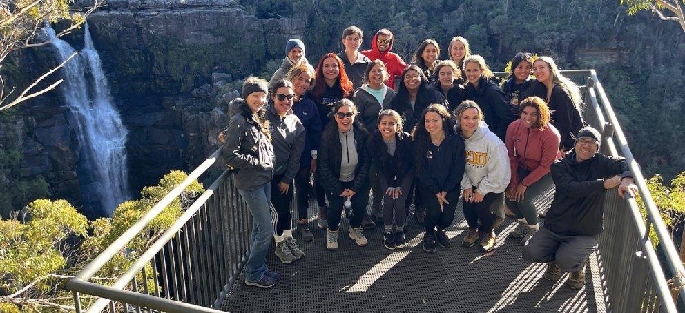 Students by a waterfall